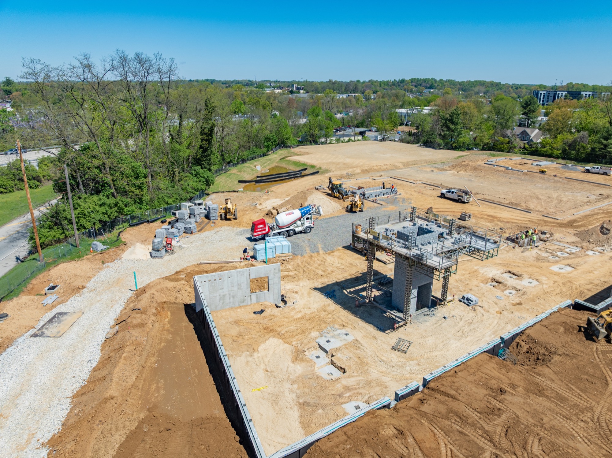 Foundation walls and concrete cores rising at 943 High Street