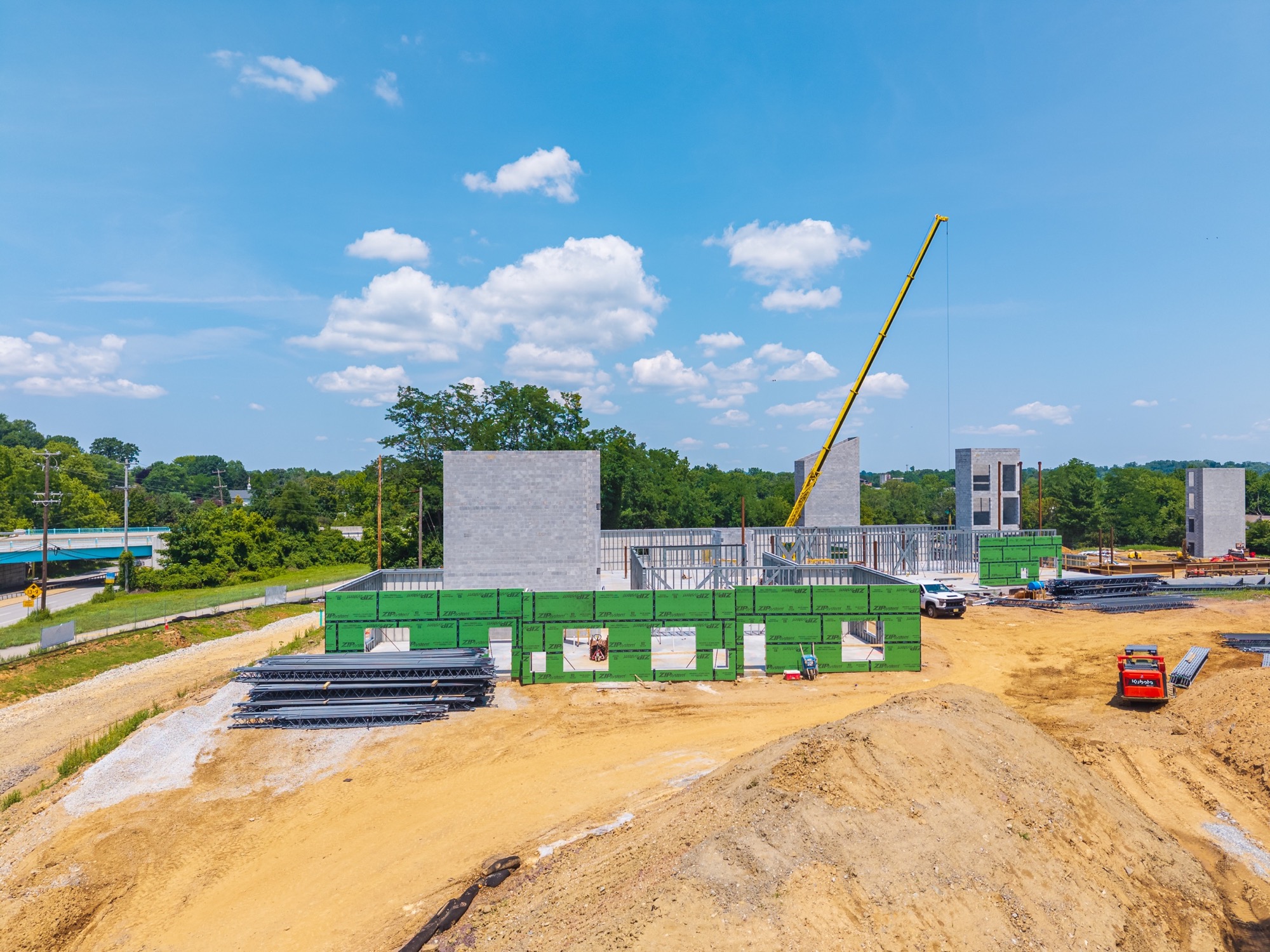 Concrete towers and exterior walls rising at High Street